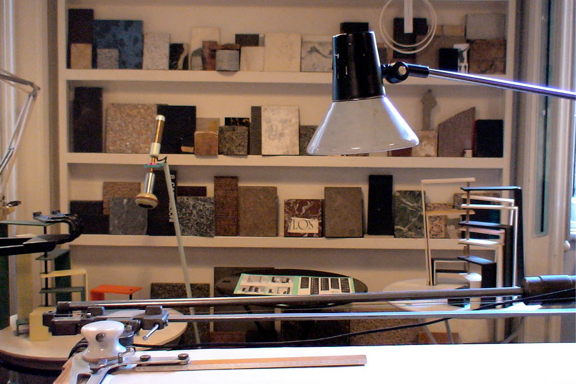 Stone and marble samples on shelves in the Esperiri showroom