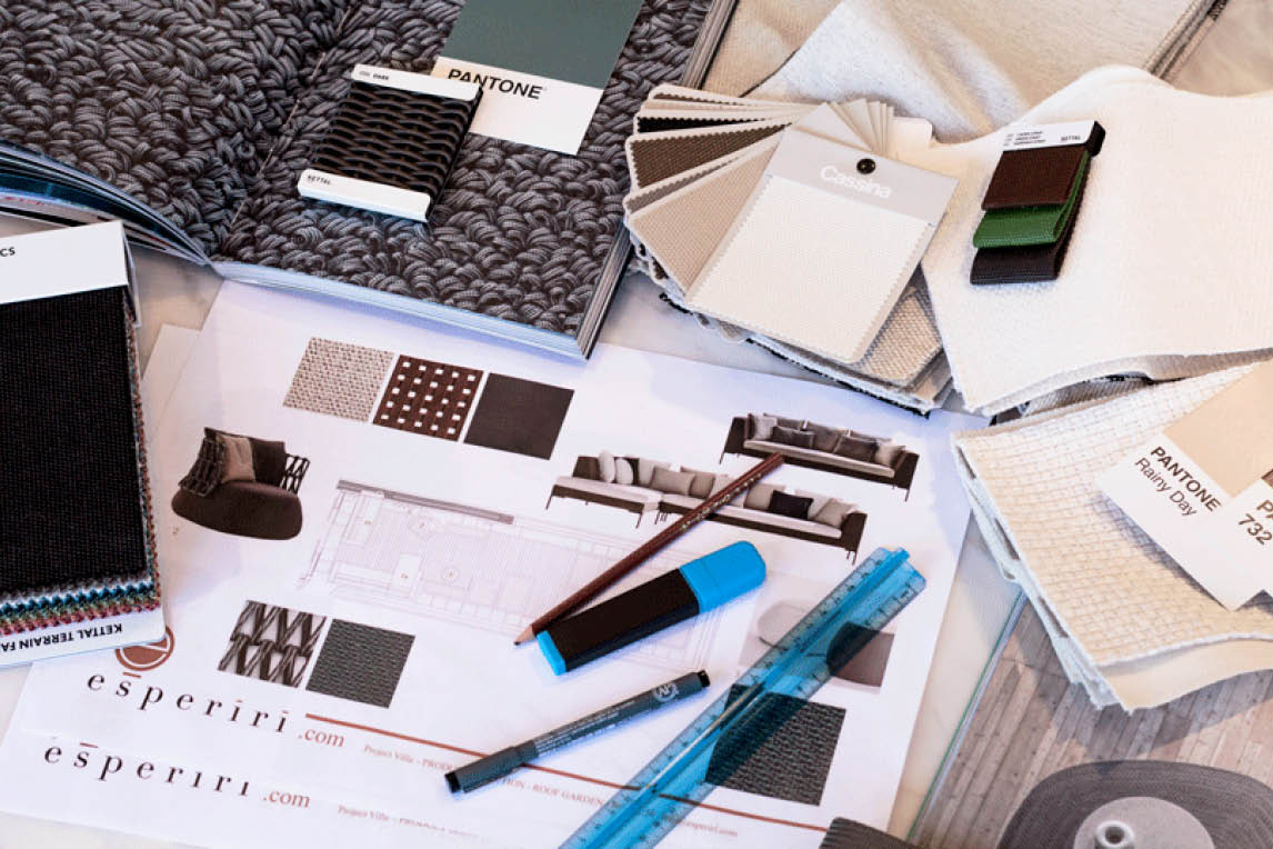 Fabric and Pantone samples with Esperiri project sheets on a desk