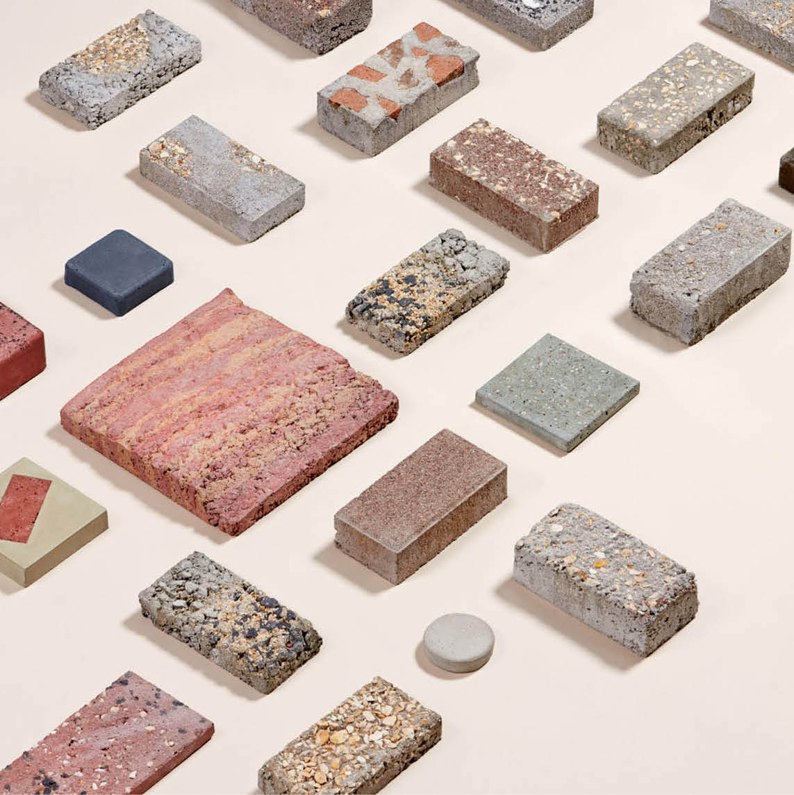 Stone and terrazzo samples arranged on a light surface