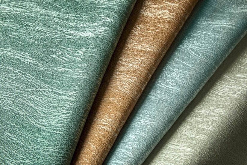 Folds of teal and gold fabric