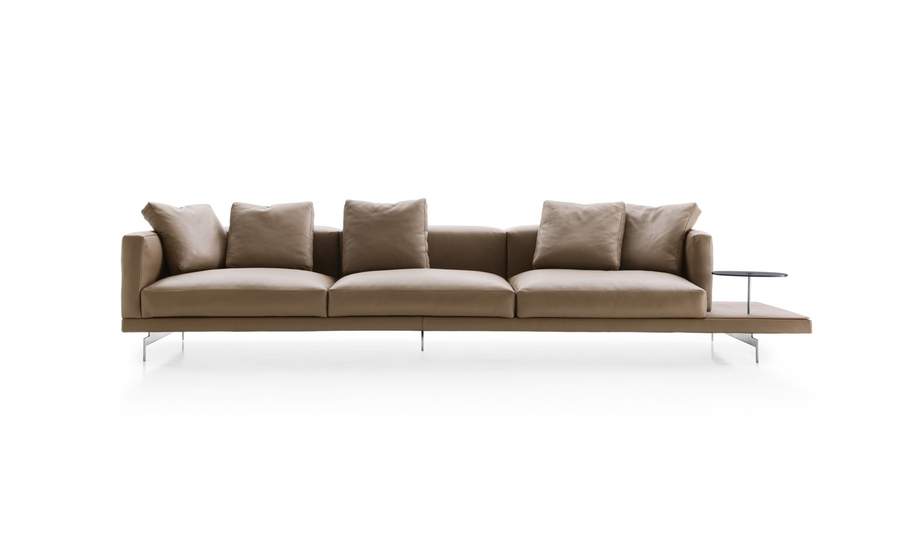 Taupe leather sofa with a built-in wooden side table on a white background