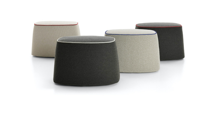 Four fabric outdoor poufs in beige and dark grey with contrast piping