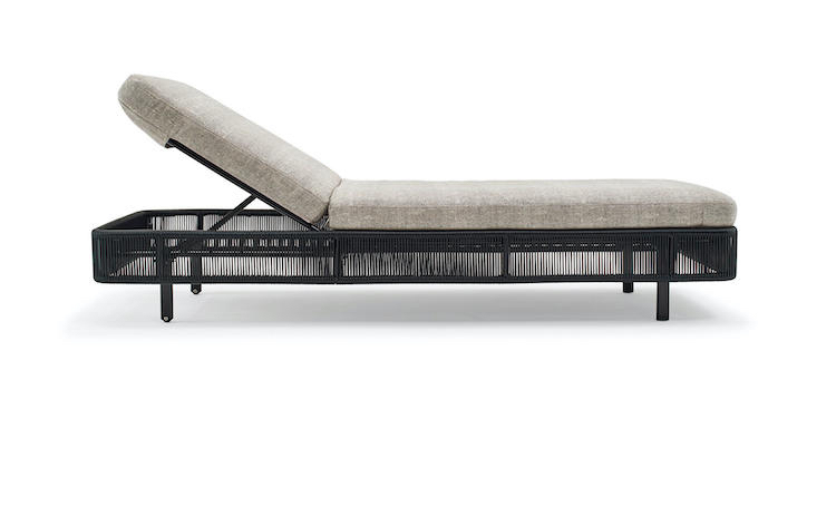 Adjustable outdoor sunbed with a black rope frame and beige cushion