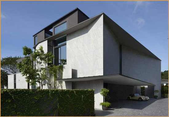 Modern white house with a carport and vintage convertible car